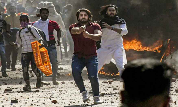 Man Who Pointed Gun at Delhi Cop During Violence arrested