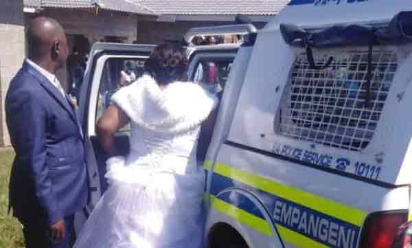 lock down violation bride and groom police arrested 