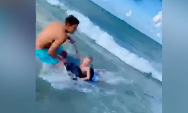 cop Pulls Boy Away From Shark
