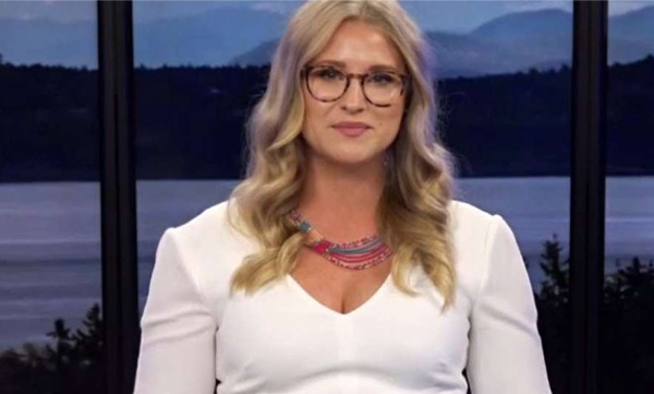 news presenter showing cleavege showing viewer message 