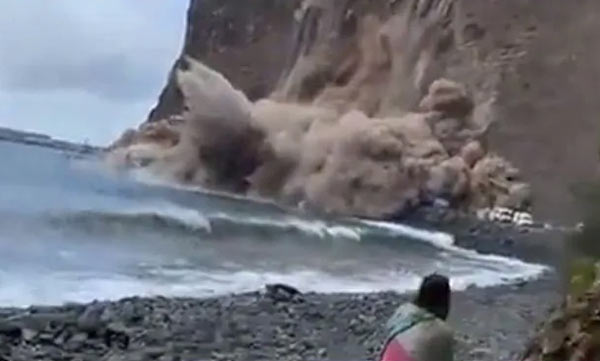 Shocking Video Shows A Huge Chunk Of Cliff Collapsing Near Beachgoers