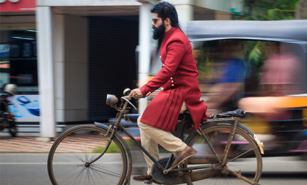 bineesh bastin rides a bycycle against petrol price hike