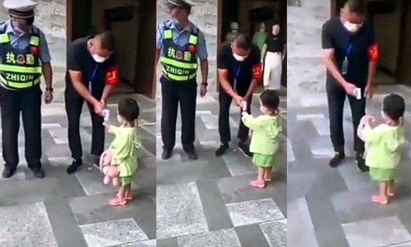 baby reminds security to check her temperature with doll