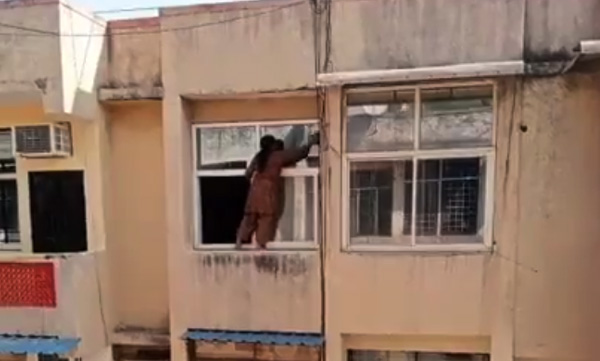 viral-video-of-woman-standing-on-the-window-ledge-of-fourth-floor