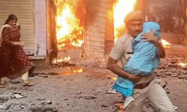 Police constable Netresh Sharma Runs Through Flames To Save Infant Amid Karauli Violence