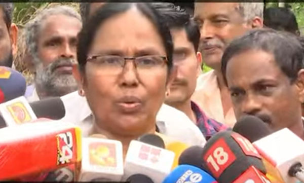 K.K Shailaja on PPE Kit row 