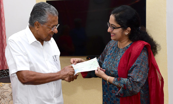 Divya.SS.Iyer handed over the prize money to the Chief Minister's Relief Fund for 'Excellence in good governance'