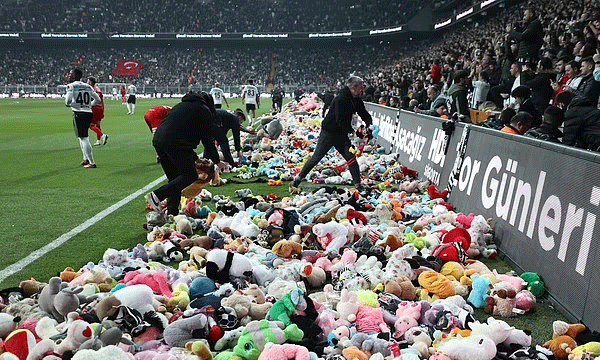 Football fans toss cuddly toys onto pitch during match in Istanbul