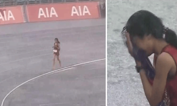 gallery claps for the last runner to finish the race