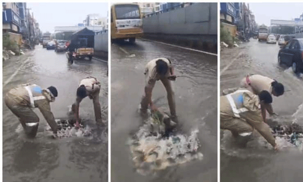 video of woman police officer cleaned the canal by hand to remove the water log went viral