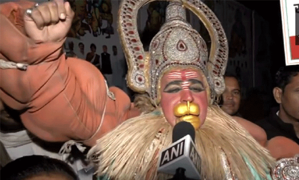 congress worker dressed as lord hanuman stands outside the party hq in delhi