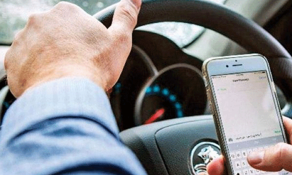 drive while talking on your mobile phone ; the license will be suspended if   three times cought  