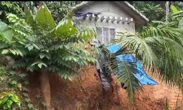 As soil was removed for road construction, the house was 15 feet above the cutting