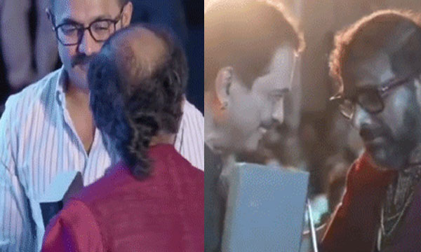 Jayaraj was called to the stage and Rameshnarayanan took the prize