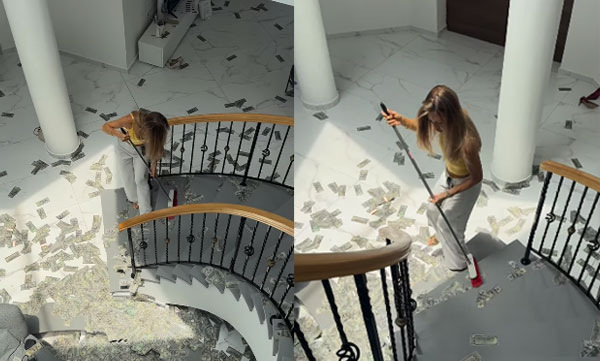 woman-sweep-up-cash-viral-video