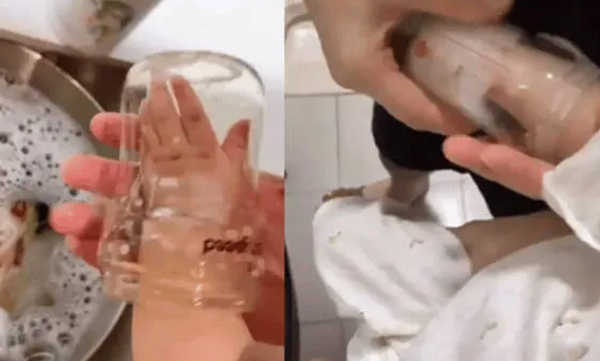 parents-using-kids-hand-to-clean-milk-bottle