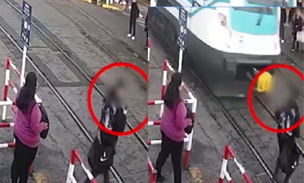 video-of-an-escape-has-gone-viral-while-talking-on-the-phone-and-crossing-the-railway-track