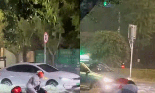 man-stuck-in-flood-with-his-scooter-strangers-helps-him-heartwarming-video