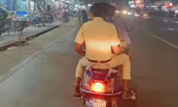 image-of-mumbai-police-riding-triple-seat-without-helmet-in-a-two-wheeler-goes-viral-in-social-media-