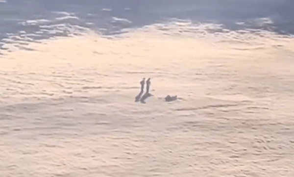 viral-video-human-figures-walking-above-the-clouds-as-seen-from-the-plane