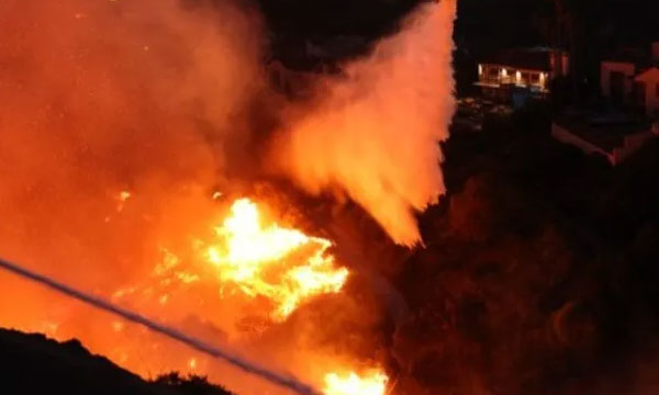 Wildfire rages through Los Angeles; 30,000 ordered to evacuate