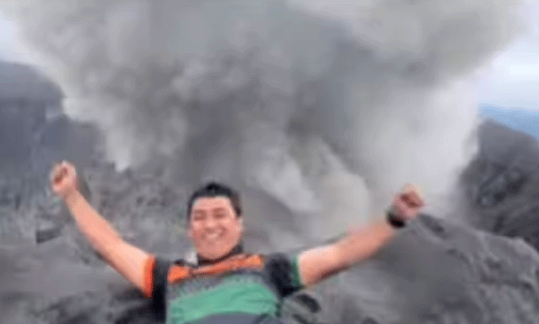 viral-video-of-a-man-smiles-in-front-of-an-erupting-volcano