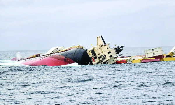 Ship completely sunk, crew rescued; No containers found, desperate effort to contain oil spill