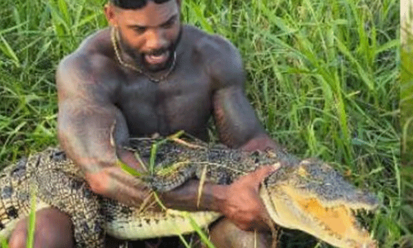 man-grabbing-crocodile-with-his-bare-hands-video
