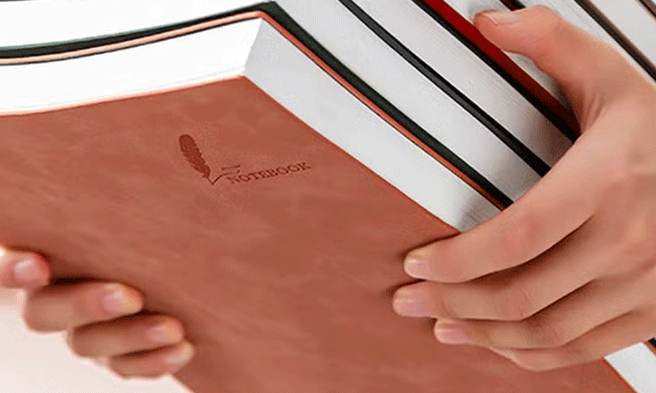 In the classroom, the teacher hit her head with a thick book