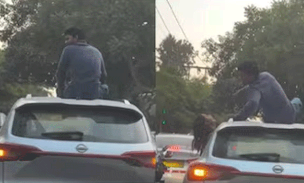 viral-video-of-a-young-man-climbing-on-to-car-rooftop
