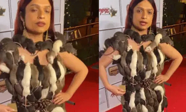 woman-walks-the-red-carpet-wearing-a-living-rat-gown