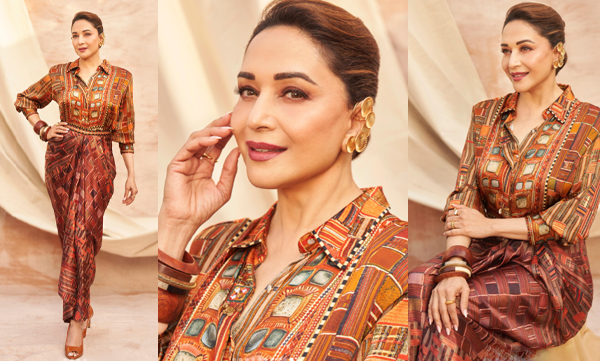 Madhuri Dixit looks elegant in a knotted art dress with ear cuffs and wooden bangles