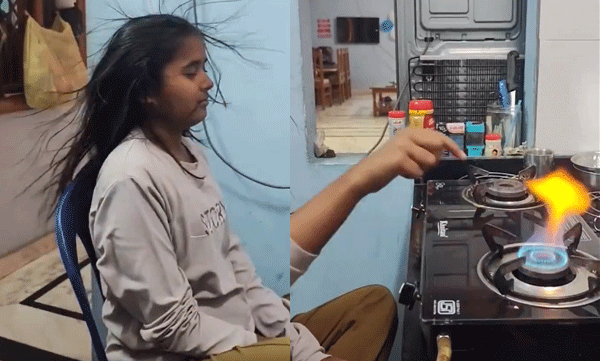video-of-woman-lighting-gas-stove-using-finger