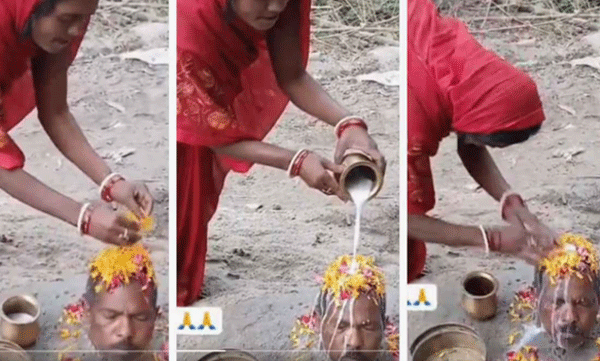 viral-video-wife-buries-husband-up-to-his-neck-and-performs-shivalinga-puja-on-his-head