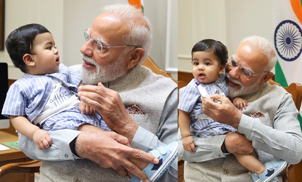 Prime minister narendra modi with cute little kid of diya krishna 