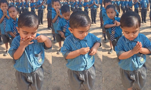 School boy secretly eats lollipop in the middile of school assembly 