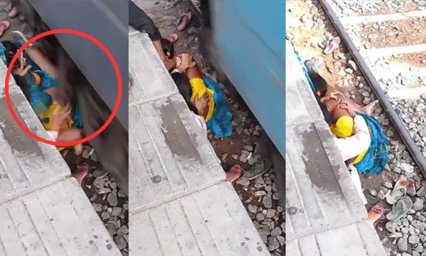 woman-braces-tracks-covers-children-with-own-body-as-train-speeds-past-video